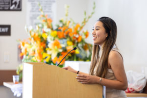 Genevieve gives a speech in front of hundreds of students and faculty.